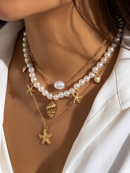 Ocean-Inspired Seashell And Diamond-Encrusted Tassel Necklace With Multi-Cross Pendant.